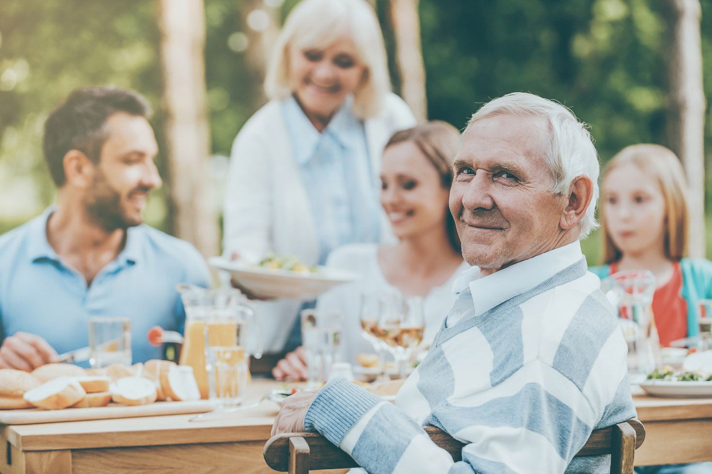 A compassionate caregiver assisting an elderly person at home
