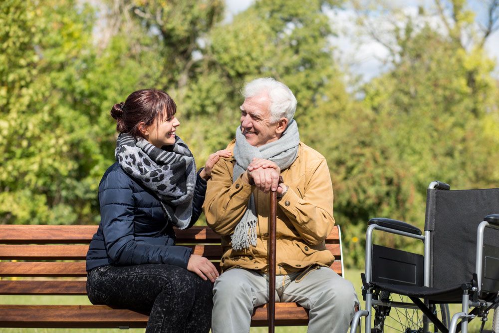 A caring professional assisting a client with a smile